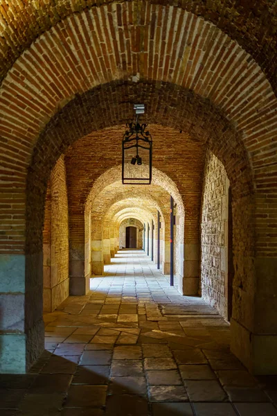 Brick arches in the passages of the castle of Montjuic in the city of Barcelona, Spain