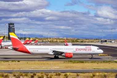 Madrid, Spain, October 30, 2022: Large Iberia plane circulating on the runways next to the international terminals at Barajas Madrid airport clipart