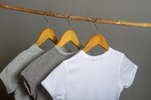 Cotton Clothes Natural Colors Hang Wooden Hanger Gray Background — Stock Photo, Image