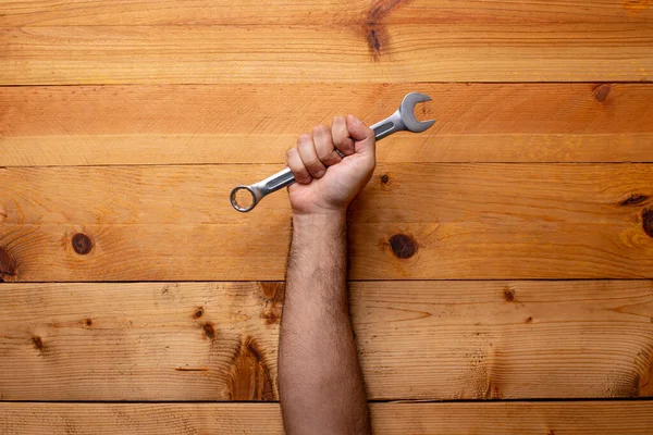 Hand Grabbing Wrench Light Wooden Background Labor Day — Stock Photo, Image