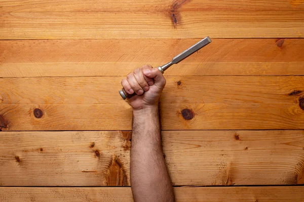 Hand Grabbing Chisel Light Wooden Background Labor Day — Stock Photo, Image