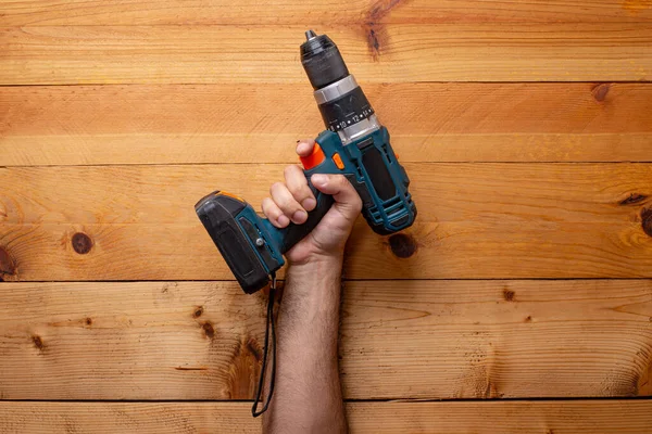 Hand Grabbing Cordless Drill Light Wood Background Labor Day — Stock Photo, Image