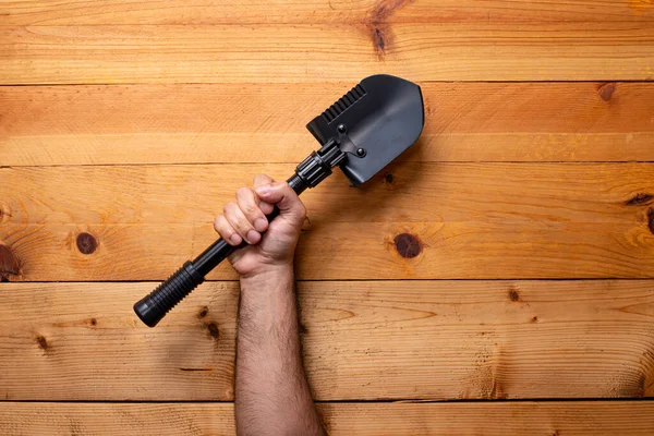 Hand Grabbing Shovel Light Wooden Background Labor Day — Stock Photo, Image