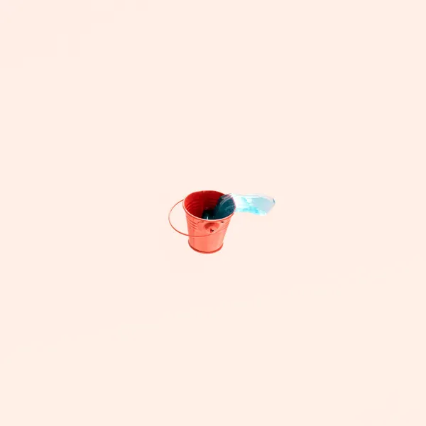 Red Metal Bucket Blue Transparent Liquid Pastel Pink Background Minimal — Stock Photo, Image