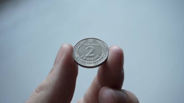 Ukrainian money in the form of two metal hryvnias.