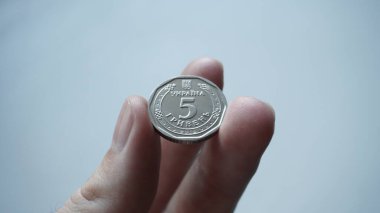 Ukrainian money - 5 metal hryvnias.