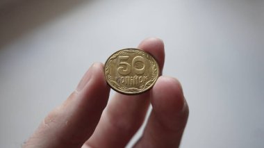 Ukrainian money - 50 metal kopecks.