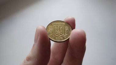 Ukrainian money - 25 metal kopecks.