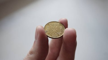 Ukrainian money - 25 metal kopecks.
