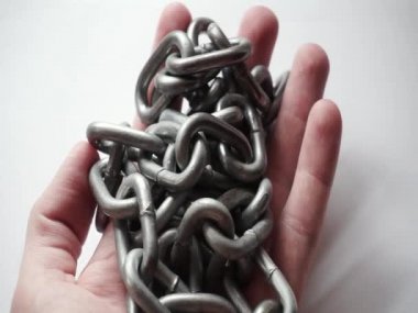 Steel chain in the hands of a man