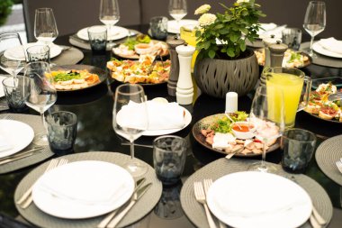 catering table with dishes and plates