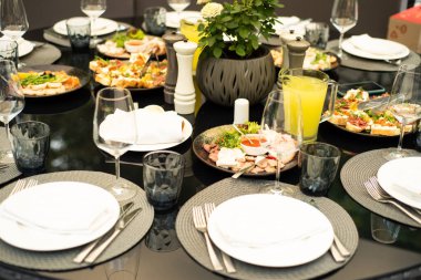 catering table with dishes and plates