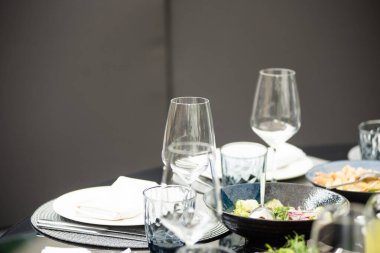 table setting with wine and cutlery on the background of the restaurant