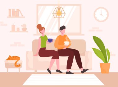 Genç çift kanepede oturuyor.