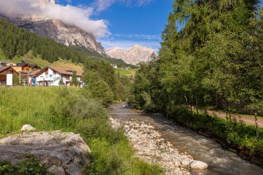 Small Italian village of Alta Badia in a mountain valley of the Dolomite Alps.