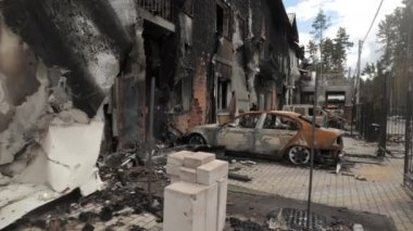 Burnt houses and cars as a result of artillery or rocket fire by the Russian army in the Kiev region