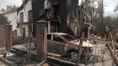Burnt houses and cars as a result of artillery or rocket fire by the Russian army in the Kiev region