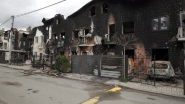 Burnt houses and cars as a result of artillery or rocket fire by the Russian army in the Kiev region