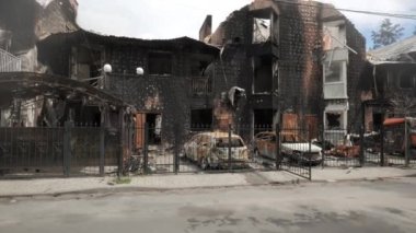 Burnt houses and cars as a result of artillery or rocket fire by the Russian army in the Kiev region