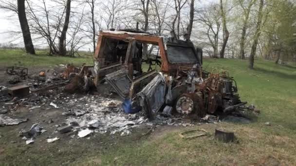 A burnt and destroyed armored car of the Russian army as a result of a battle with Ukrainian troops near Kyiv — Stock Video