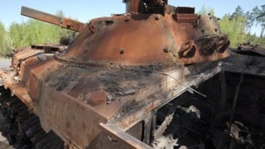 Burnt and destroyed armored personnel carrier of the Russian army as a result of the battle with the Ukrainian troops. Russian aggression in Ukraine. Ukraine is waging a liberation war with Russia.