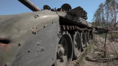 Destroyed and burnt-out tank of the Russian army as a result of the battle with Ukrainian troops in the forest near Kyiv, Ukraine. Russian aggression in Ukraine.