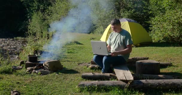 Man Works Laptop Tourist Camp Beautiful Forest Concept Freelancing Digital — Stock videók