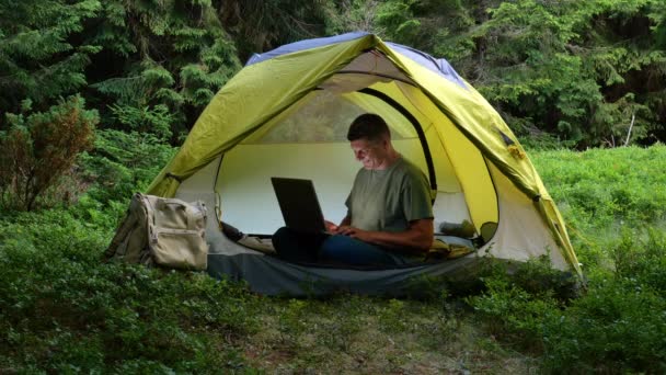 Man Works Laptop Tourist Camp Beautiful Forest Concept Freelancing Digital — Video Stock