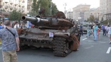 KYIV, UKRAINE - AUG 22, 2022: Destroyed Russian military equipment in the center of Kyiv on Khreshchatyk. People inspect and photograph captured Russian tanks on Ukraines Independence Day.