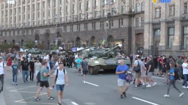 KYIV, UKRAINE - AUG 22, 2022: Destroyed Russian military equipment in the center of Kyiv on Khreshchatyk. People inspect and photograph captured Russian tanks on Ukraines Independence Day.