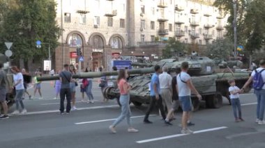 KYIV, UKRAINE - AUG 22, 2022: Destroyed Russian military equipment in the center of Kyiv on Khreshchatyk. People inspect and photograph captured Russian tanks on Ukraines Independence Day.