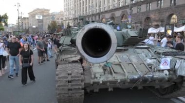 KYIV, UKRAINE - AUG 22, 2022: Destroyed Russian military equipment in the center of Kyiv on Khreshchatyk. People inspect and photograph captured Russian tanks on Ukraines Independence Day.