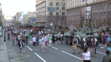 KYIV, UKRAINE - AUG 22, 2022: Destroyed Russian military equipment in the center of Kyiv on Khreshchatyk. People inspect and photograph captured Russian tanks on Ukraines Independence Day.