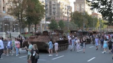 KYIV, UKRAINE - AUG 22, 2022: Destroyed Russian military equipment in the center of Kyiv on Khreshchatyk. People inspect and photograph captured Russian tanks on Ukraines Independence Day.