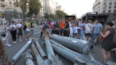 KYIV, UKRAINE - AUG 22, 2022: Destroyed Russian military equipment in the center of Kyiv on Khreshchatyk. People inspect and photograph captured Russian tanks on Ukraines Independence Day.