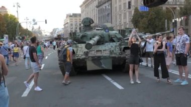 KYIV, UKRAINE - AUG 22, 2022: Destroyed Russian military equipment in the center of Kyiv on Khreshchatyk. People inspect and photograph captured Russian tanks on Ukraines Independence Day.