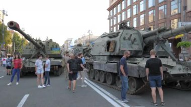 KYIV, UKRAINE - AUG 22, 2022: Destroyed Russian military equipment in the center of Kyiv on Khreshchatyk. People inspect and photograph captured Russian tanks on Ukraines Independence Day.