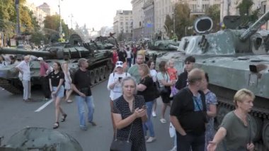 KYIV, UKRAINE - AUG 22, 2022: Destroyed Russian military equipment in the center of Kyiv on Khreshchatyk. People inspect and photograph captured Russian tanks on Ukraines Independence Day.