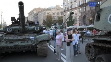 KYIV, UKRAINE - AUG 22, 2022: Destroyed Russian military equipment in the center of Kyiv on Khreshchatyk. People inspect and photograph captured Russian tanks on Ukraines Independence Day.