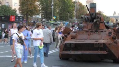KYIV, UKRAINE - AUG 22, 2022: Destroyed Russian military equipment in the center of Kyiv on Khreshchatyk. People inspect and photograph captured Russian tanks on Ukraines Independence Day.
