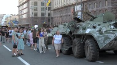 KYIV, UKRAINE - AUG 22, 2022: Destroyed Russian military equipment in the center of Kyiv on Khreshchatyk. People inspect and photograph captured Russian tanks on Ukraines Independence Day.