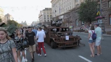KYIV, UKRAINE - AUG 22, 2022: Destroyed Russian military equipment in the center of Kyiv on Khreshchatyk. People inspect and photograph captured Russian tanks on Ukraines Independence Day.