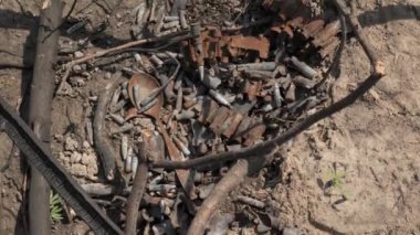 Rusty shells and bullets on the ground after the battle. 4K