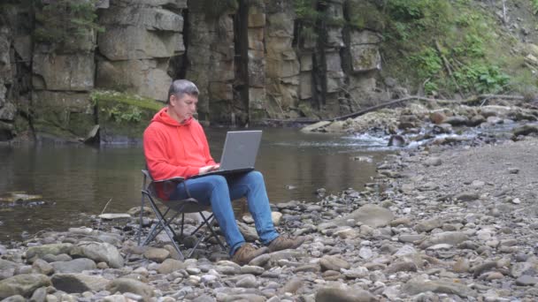 Man Works Laptop Stream Nature Concept Freelancing Digital Nomad Remote — 图库视频影像