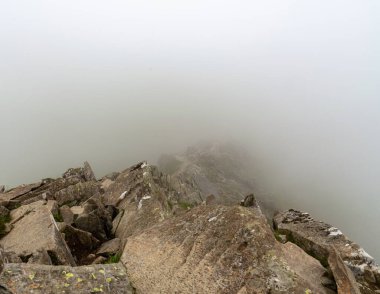 National Park Lake District, Helvellyn Hills, view while climbing Lake Thirlmere and Red Tarm, crossing Striding Edge and Swirral Edge during fog, 2022.