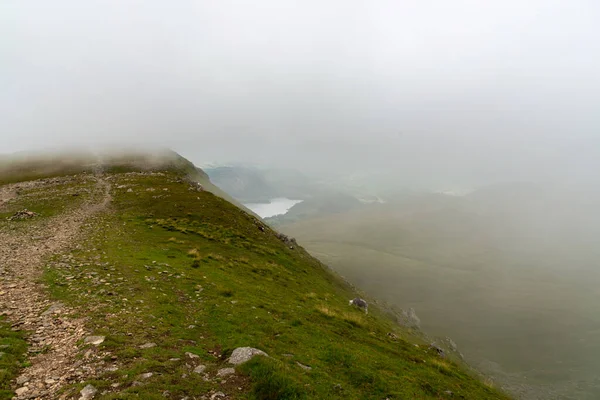 National Park Lake District, Helvellyn Hills, view while climbing Lake Thirlmere and Red Tarm, crossing Striding Edge and Swirral Edge during fog, 2022.