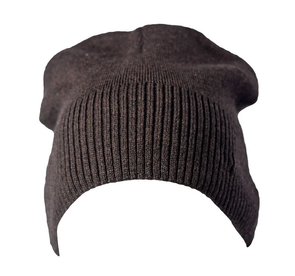 女人的褐色帽子是用白色的背景织成的 暖冬饰物 — 图库照片