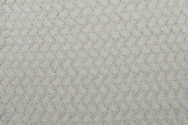 Örgü arka plan, doku, desen. Örgü örgüsüyle numunenin yakın çekimi.