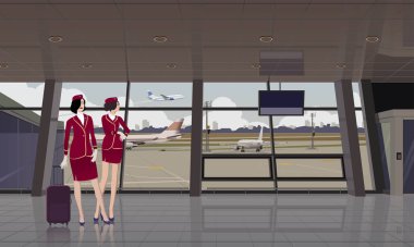 İki hostes havaalanı binasında uçak arkaplanına karşı duruyor..