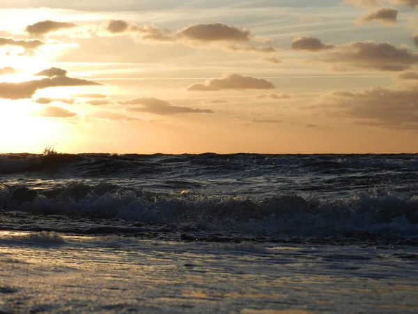 Beautiful sunset on the Baltic Sea. A walk along the seashore during your vacation. Perfect wallpaper.
